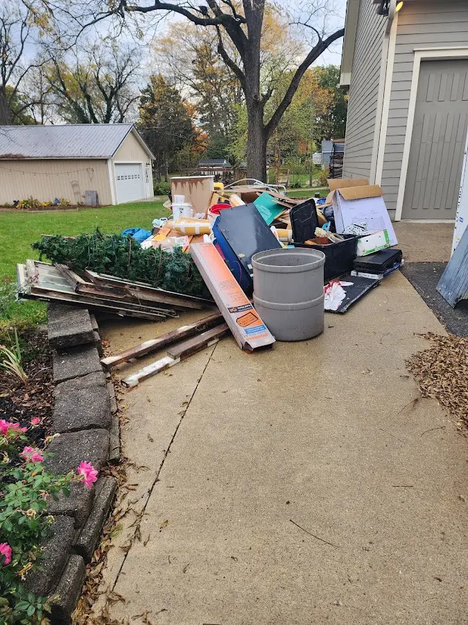 Dumpster being loaded with debris for Commercial Dumpster Rental in La Porte